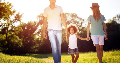 Family taking a walk in nature in a beautiful park